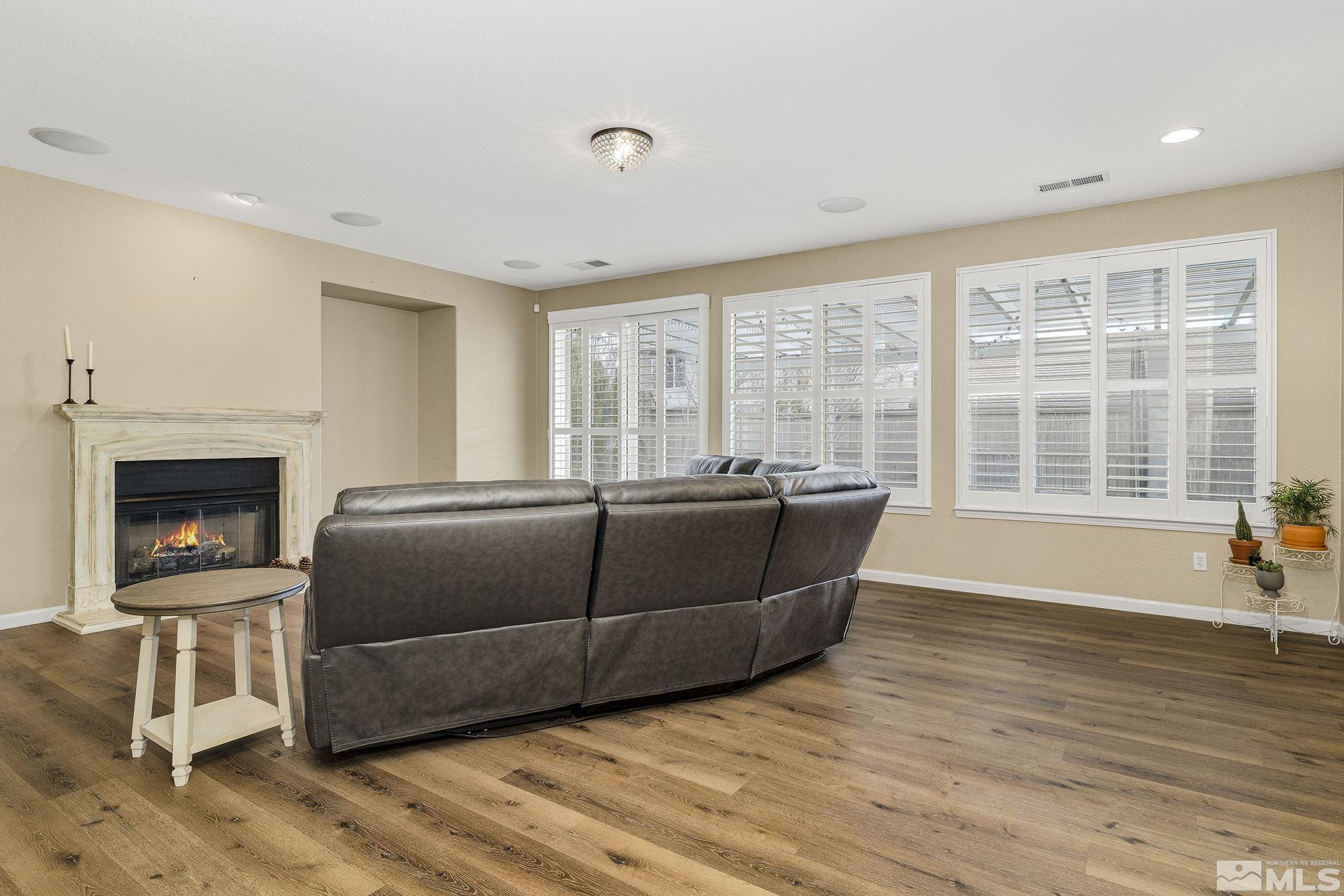 495 Dartmoor Court Reno, NV 89521 - Photo 3 of 22 a living room with furniture and a fireplace