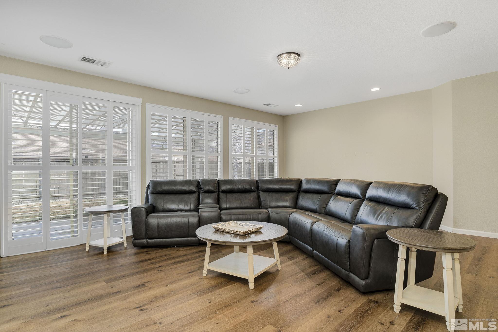 495 Dartmoor Court Reno, NV 89521 - Photo 4 of 22 a living room with furniture and a wooden floor