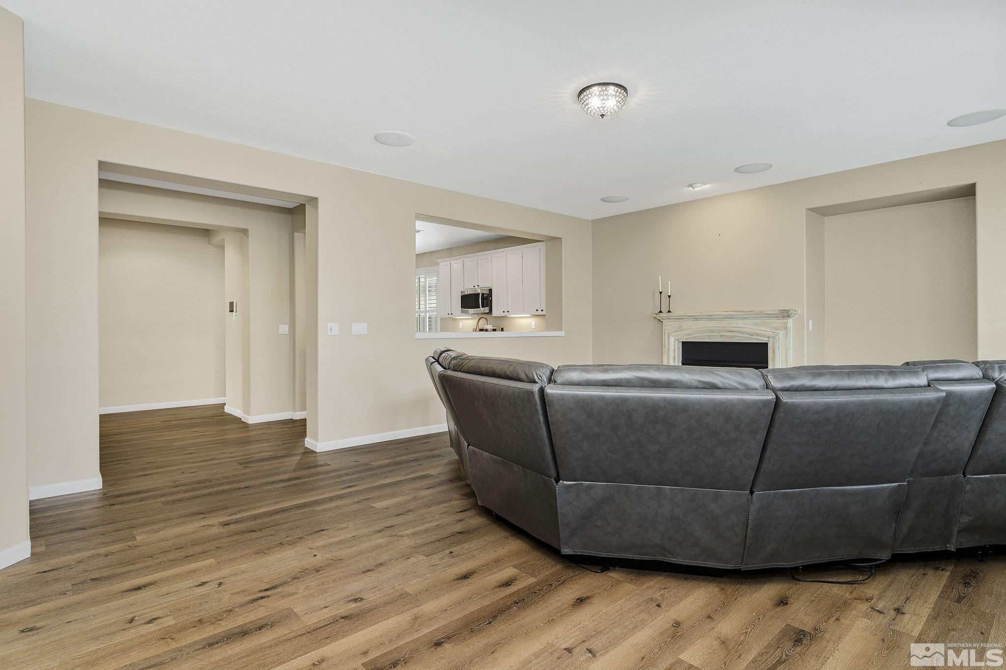 495 Dartmoor Court Reno, NV 89521 - Photo 5 of 22 a living room with furniture and a wooden floor