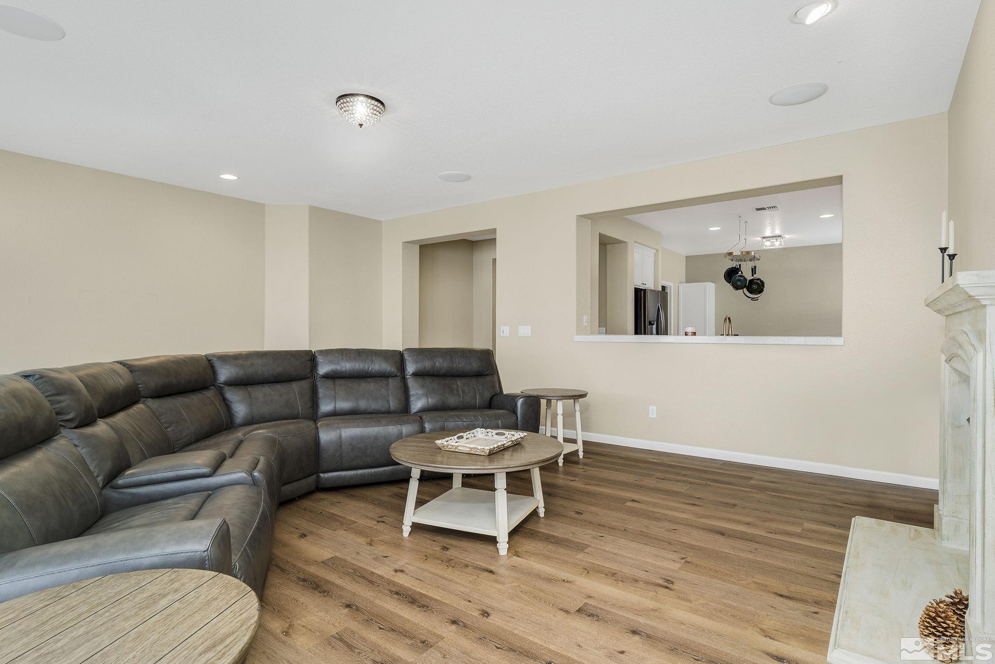 495 Dartmoor Court Reno, NV 89521 - Photo 6 of 22 a living room with furniture and a wooden floor
