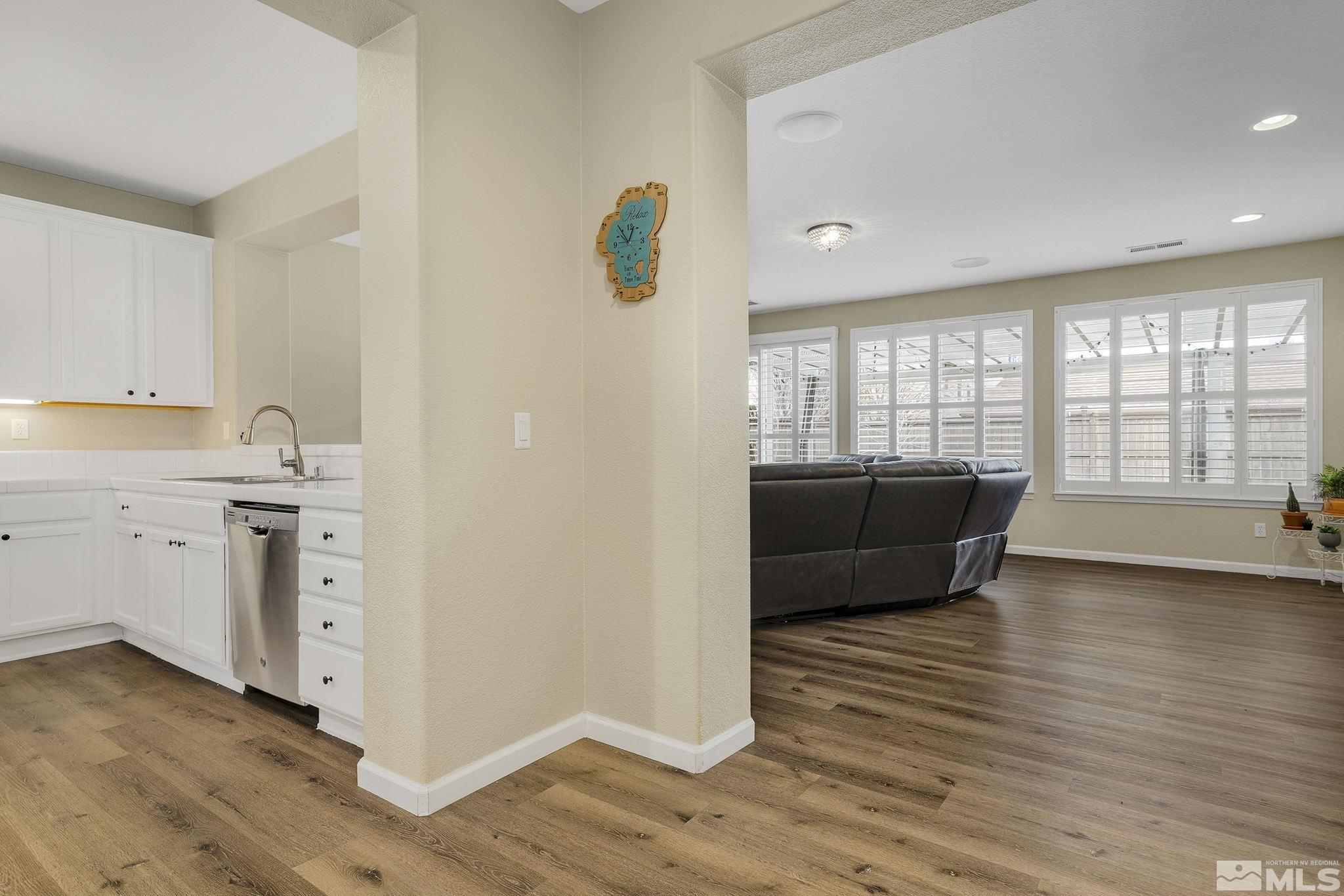 495 Dartmoor Court Reno, NV 89521 - Photo 7 of 22 a view of kitchen with wooden floor and electronic appliances