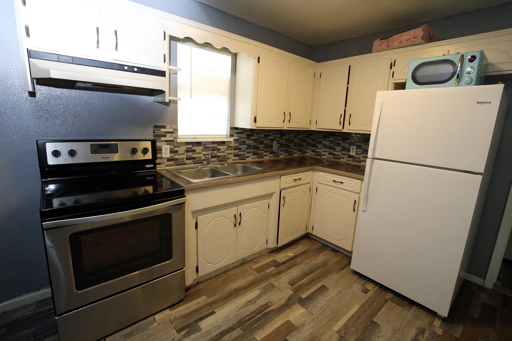 4406 FM 646 Road Santa Fe, TX 77510 - Photo 24 of 26 Kitchen in the Garage Apartment comes with the refrigerator and stove.