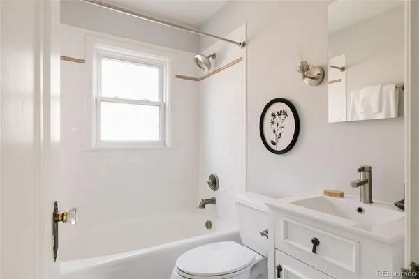 a bathroom with a toilet a sink and a bathtub