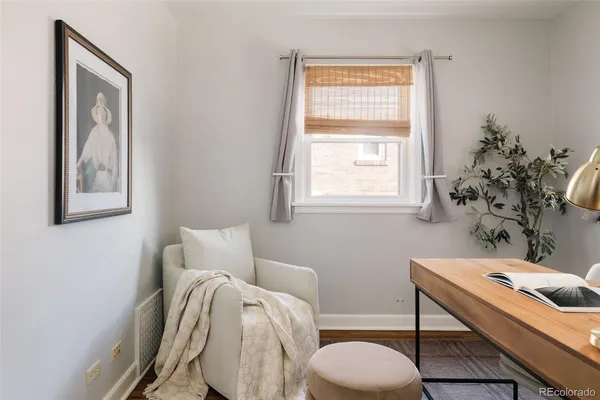 a bedroom with a bed and a table