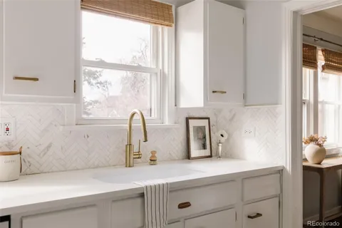 a kitchen with a sink and a window