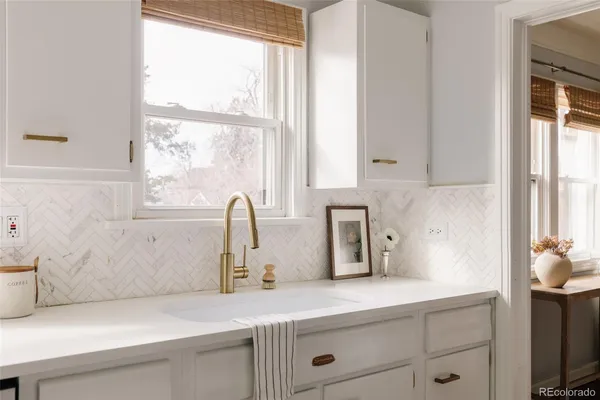 a kitchen with a sink and a window
