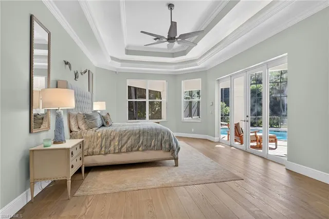 a bedroom with a bed couch and window