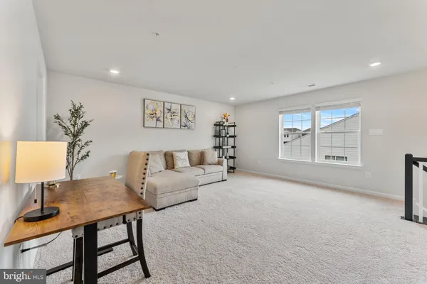 a living room with furniture and a table