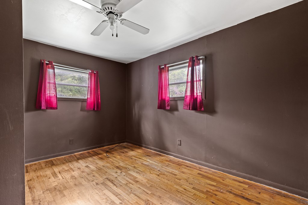 7255 Blue Ridge Drive Blue Ridge, GA 30513 - Photo 18 of 24 a view of empty room with wooden floor and fan
