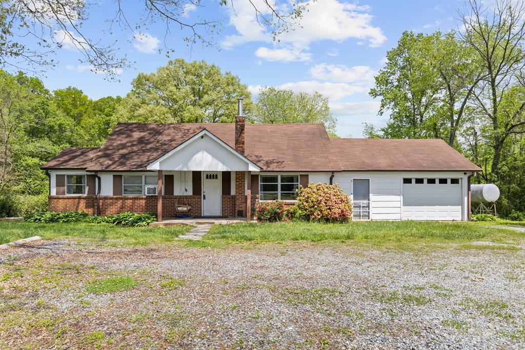 7255 Blue Ridge Drive Blue Ridge, GA 30513 - Photo 2 of 24 a view of a house with a big yard and large trees