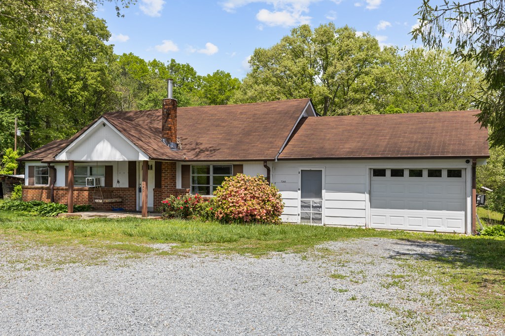 7255 Blue Ridge Drive Blue Ridge, GA 30513 - Photo 24 of 24 a front view of a house with garden