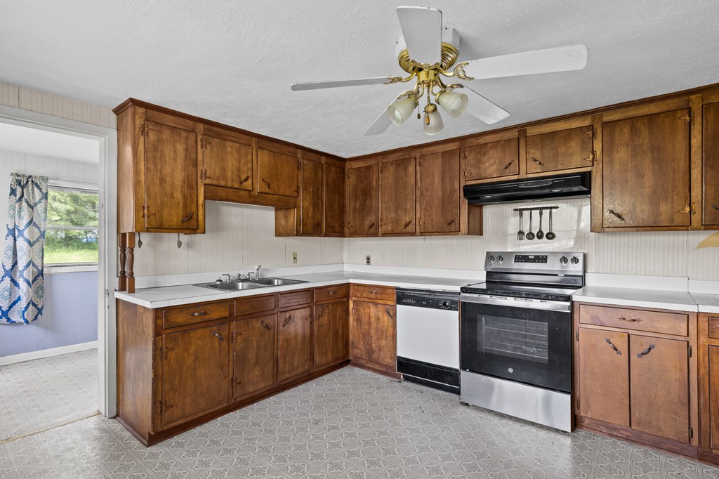 7255 Blue Ridge Drive Blue Ridge, GA 30513 - Photo 7 of 24 a kitchen with cabinets a sink and stainless steel appliances