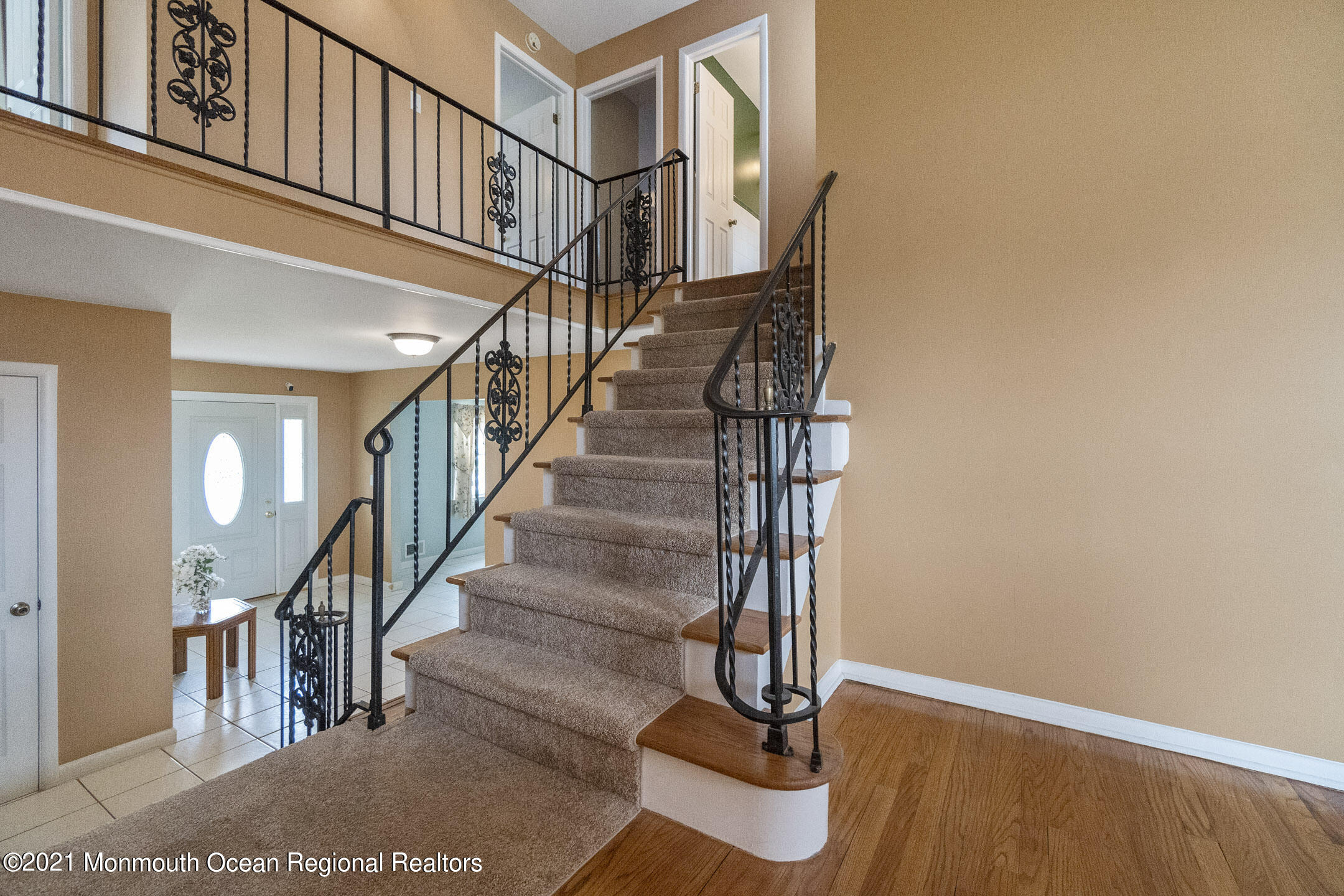 27 South Westfield Road Howell, NJ 07731 - Photo 14 of 27 a view of staircase with wooden floor and a rug