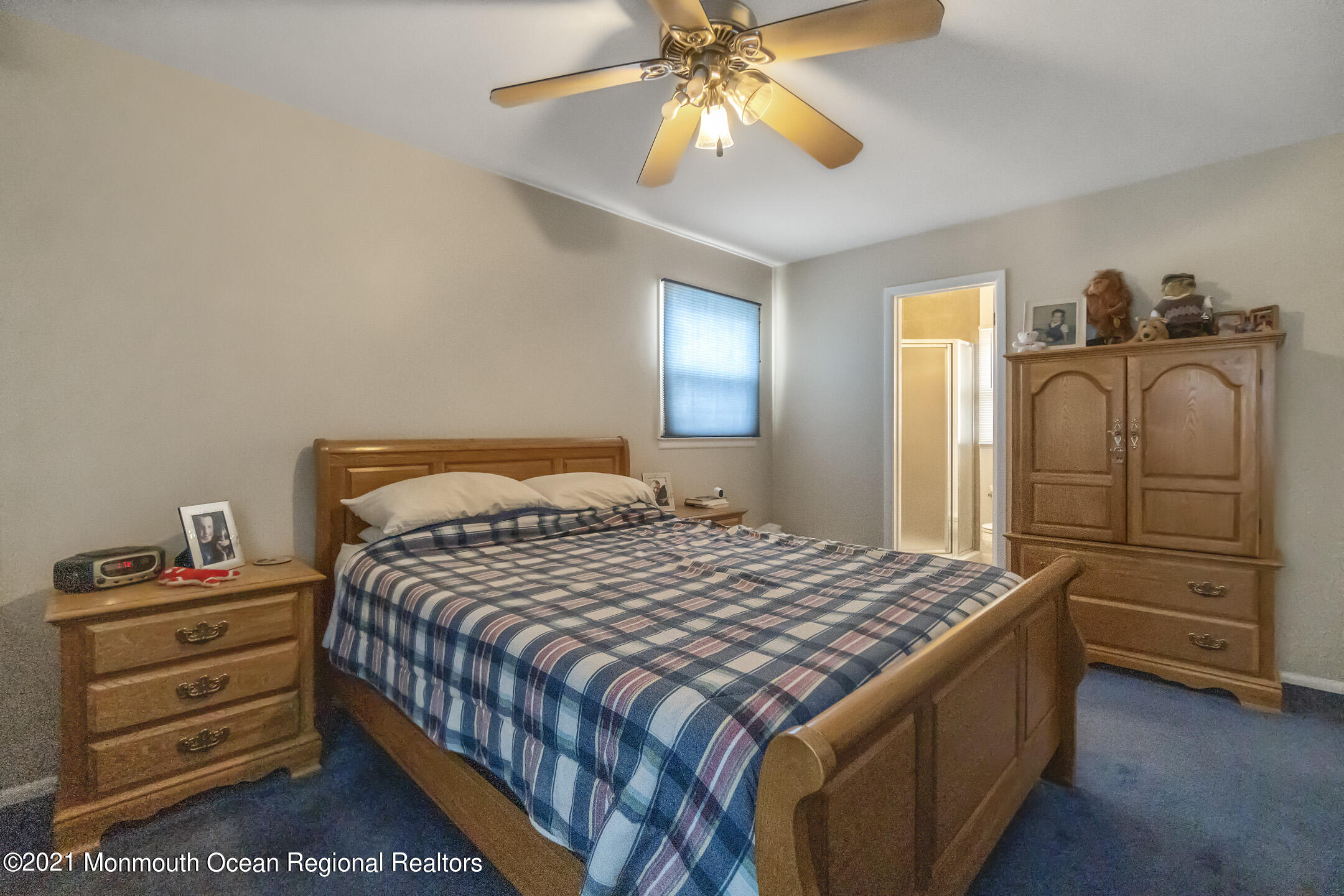 27 South Westfield Road Howell, NJ 07731 - Photo 23 of 27 a bedroom with a bed and a chandelier