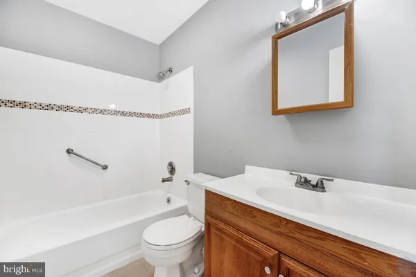 a view of an empty room with a fireplace