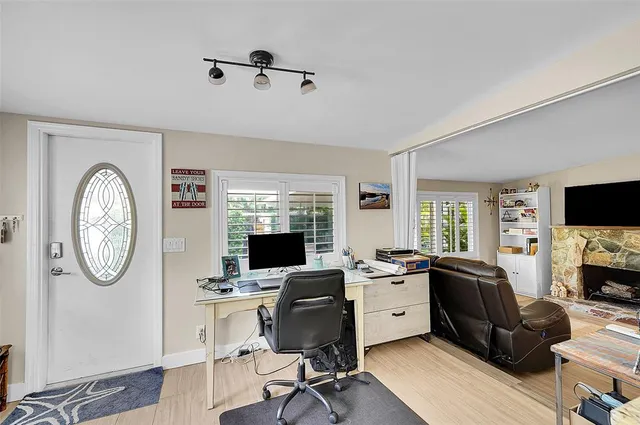 a view of a livingroom with furniture and a flat screen tv