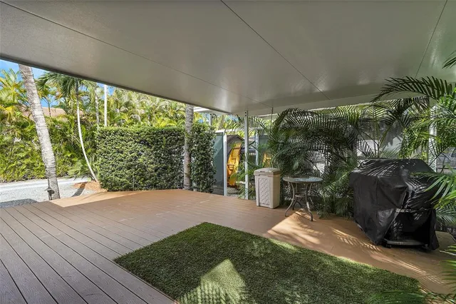 a view of a porch with furniture and yard