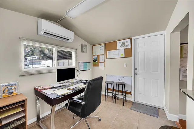 a workspace with furniture and window