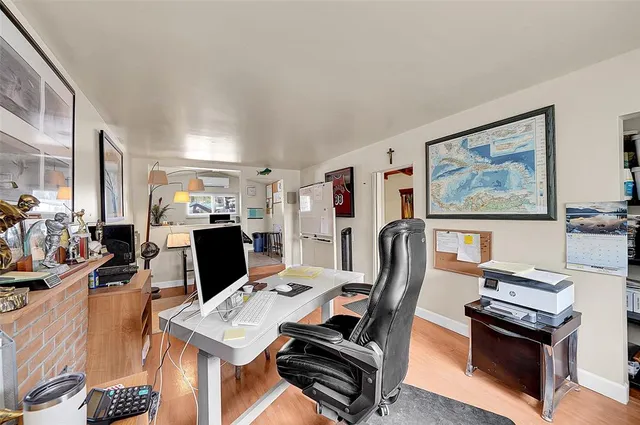 a workspace with furniture and a flat screen tv