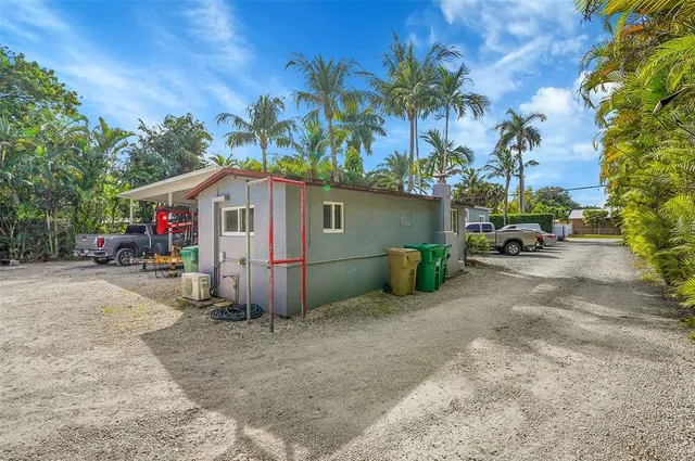 a view of a car park in front of house