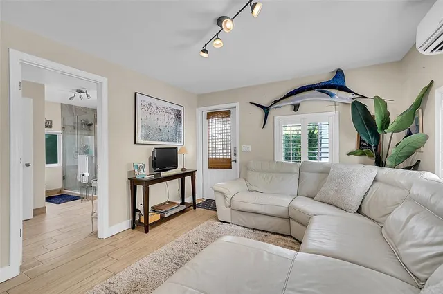 a living room with furniture and a window