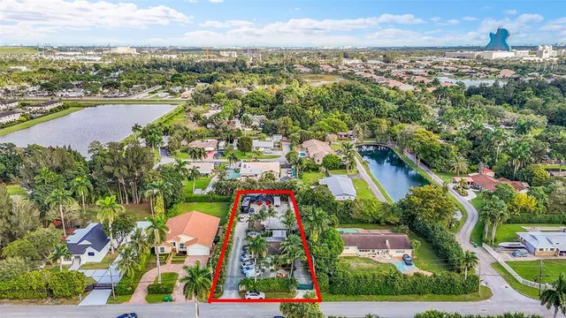 an aerial view of residential houses with outdoor space