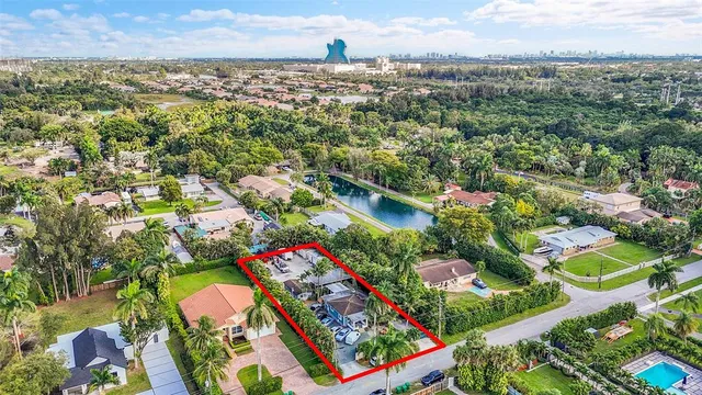 an outdoor space with seating area and trees around