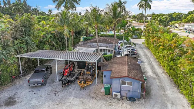 a view of a backyard with sitting area