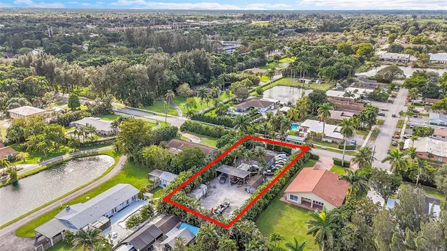 an aerial view of a house and outdoor space