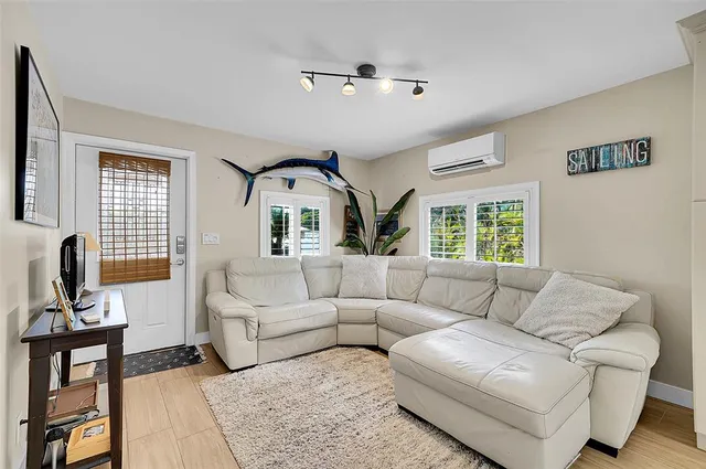 a living room with a couch and a window