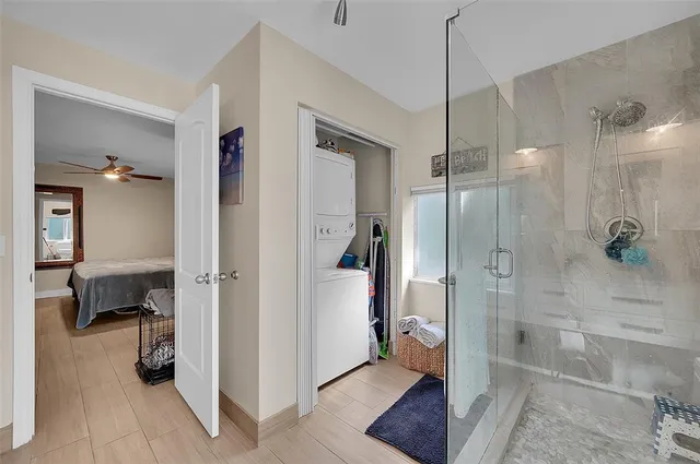 a bathroom with a shower and a sink