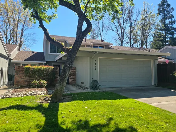 a front view of a house with a garage