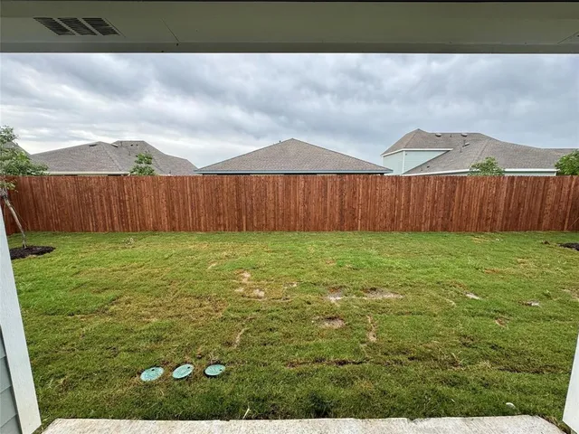 a bathroom with a tub sink and vanity