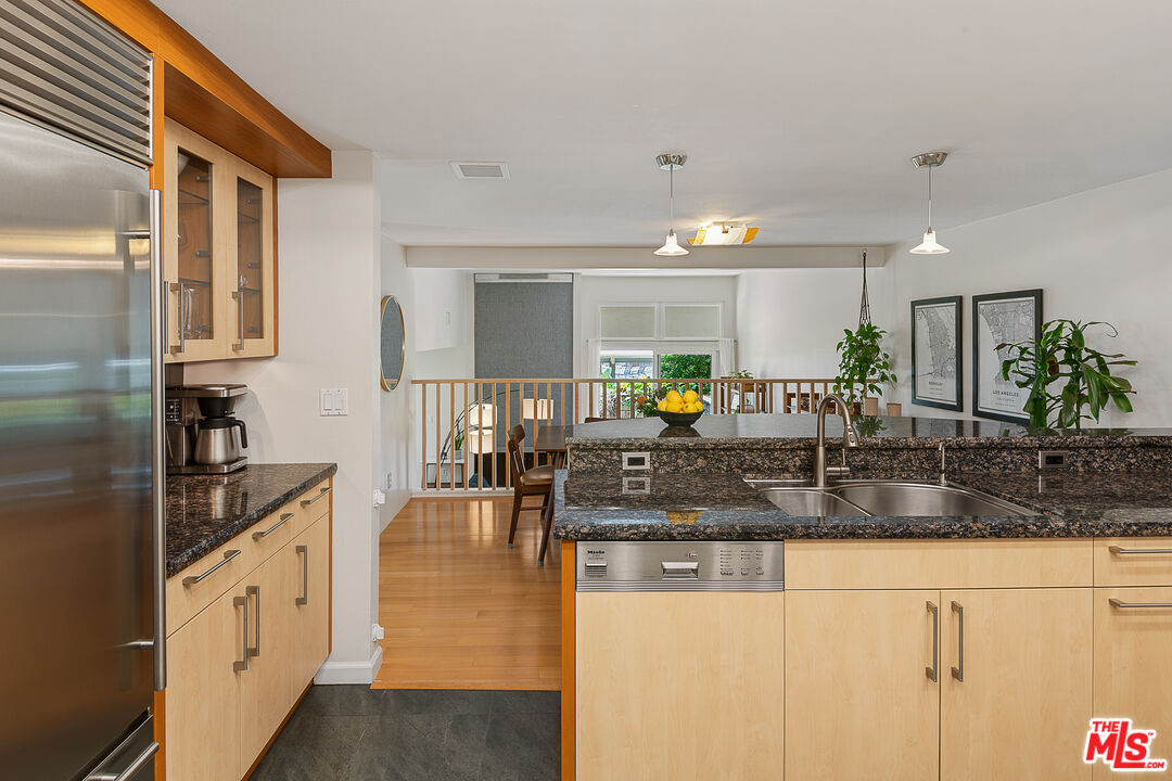13214 Fiji Way, Unit P Marina del Rey, CA 90292 - Photo 13 of 41 a kitchen with stainless steel appliances granite countertop a sink counter space and cabinets
