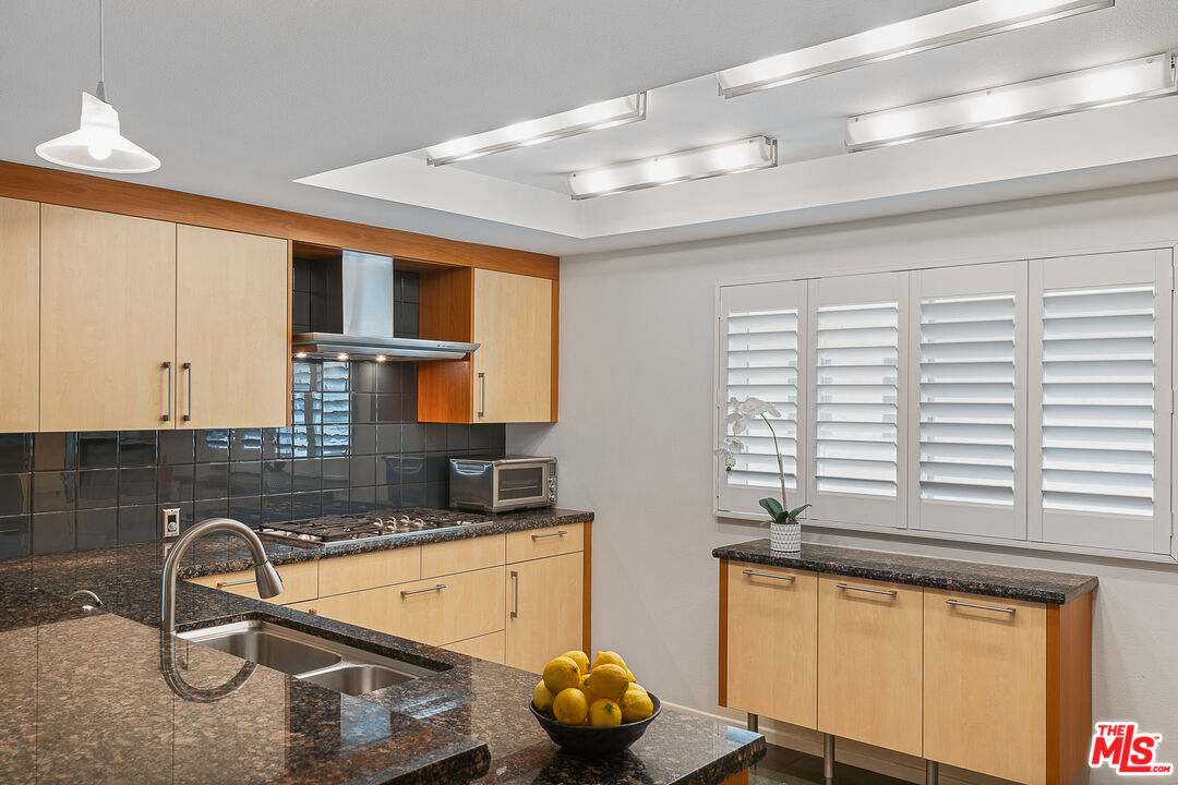 13214 Fiji Way, Unit P Marina del Rey, CA 90292 - Photo 16 of 41 a kitchen with a sink a window and cabinets