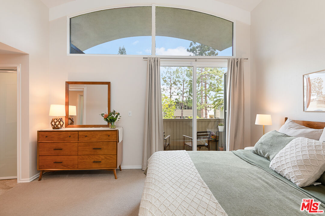 13214 Fiji Way, Unit P Marina del Rey, CA 90292 - Photo 22 of 41 a bedroom with a bed and a table