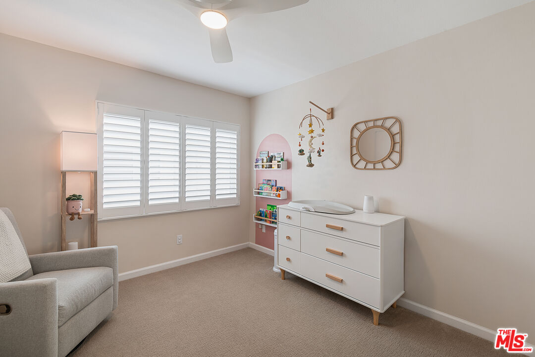 13214 Fiji Way, Unit P Marina del Rey, CA 90292 - Photo 28 of 41 a room with a baby crib with a dresser