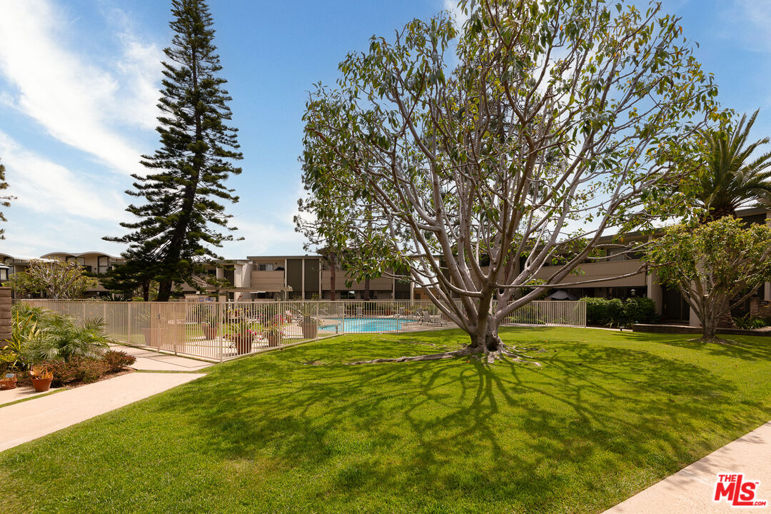 13214 Fiji Way, Unit P Marina del Rey, CA 90292 - Photo 40 of 41 a house with swimming pool in front of it