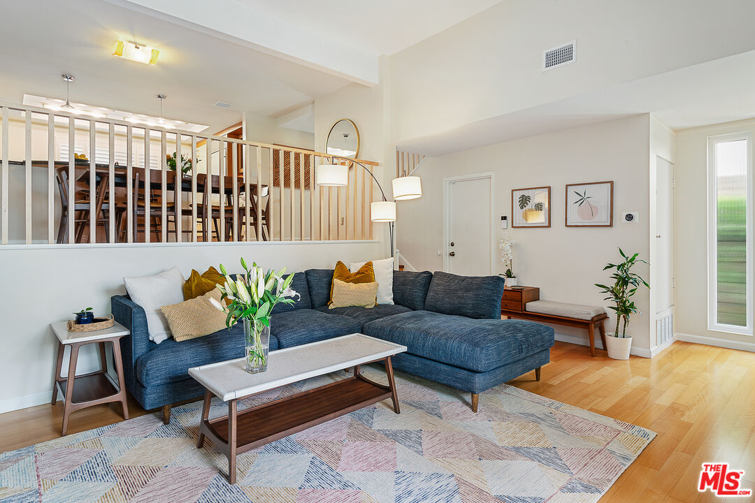 13214 Fiji Way, Unit P Marina del Rey, CA 90292 - Photo 5 of 41 a living room with furniture and a wooden floor