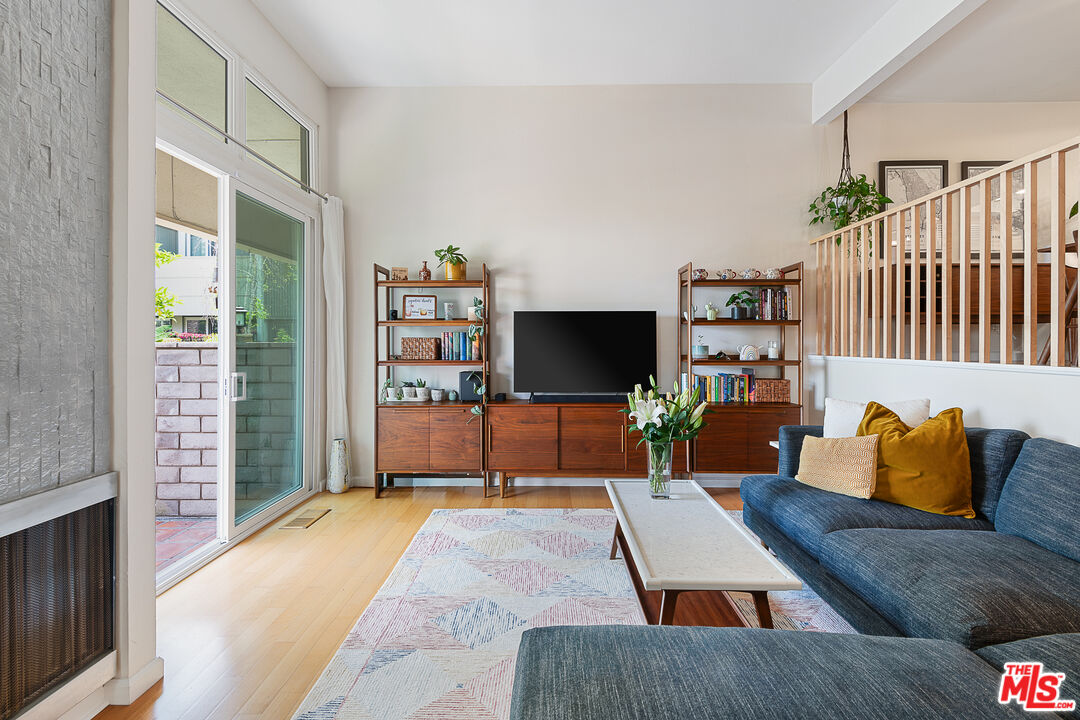 13214 Fiji Way, Unit P Marina del Rey, CA 90292 - Photo 6 of 41 a living room with furniture and a flat screen tv