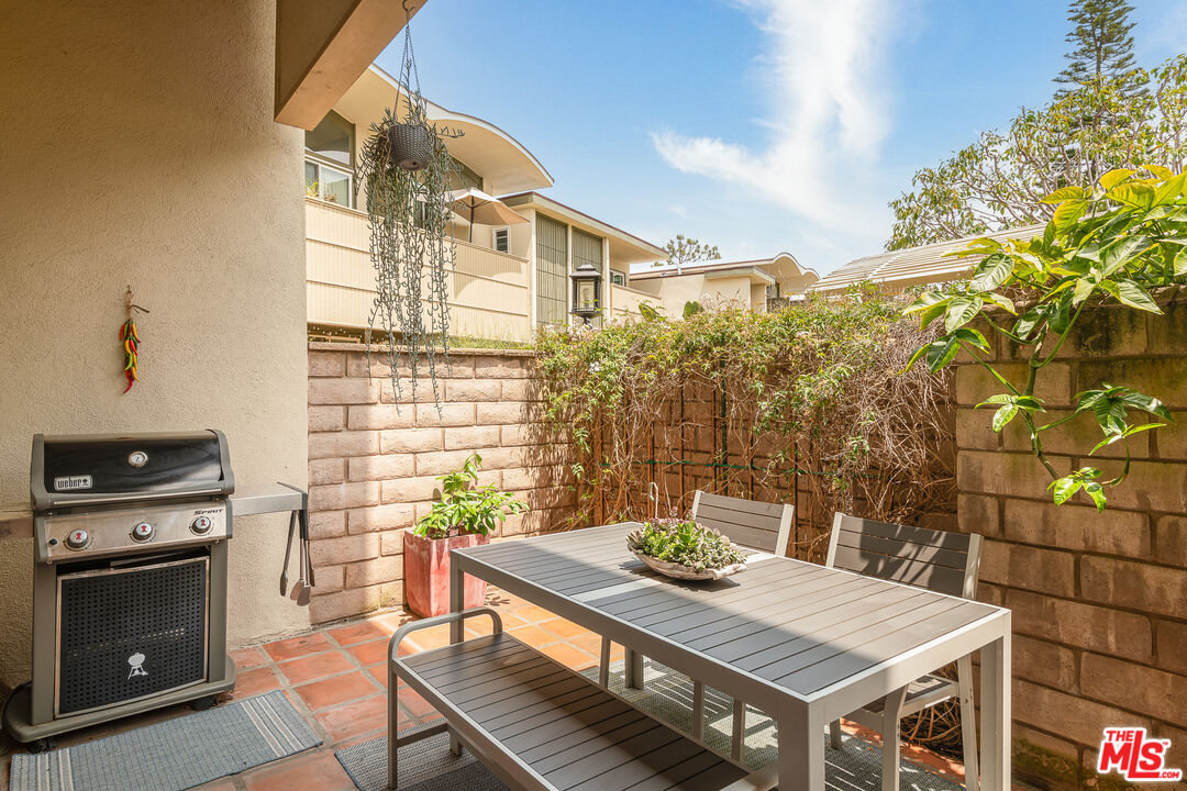 13214 Fiji Way, Unit P Marina del Rey, CA 90292 - Photo 8 of 41 a view of a dinning table and chairs in patio
