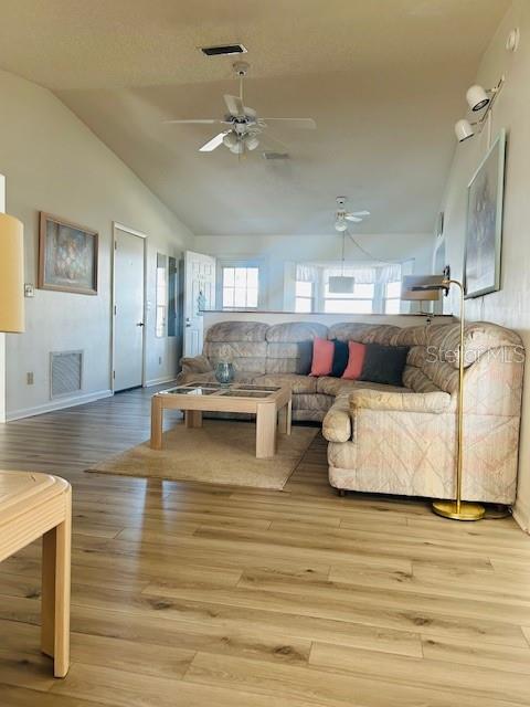 8506 Southwest 93rd Street, Unit B Ocala, FL 34481 - Photo 2 of 8 a living room with furniture and kitchen view