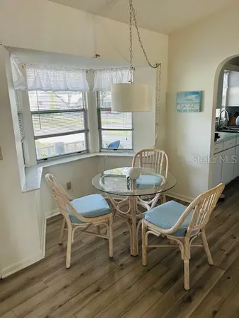 a bedroom with bed and window