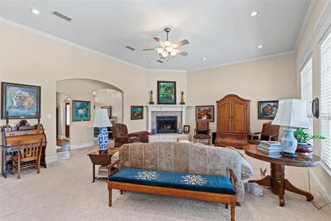 a bedroom with furniture and a fireplace