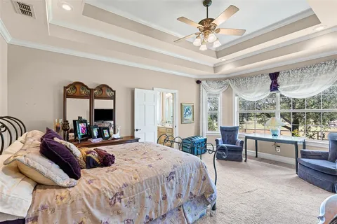 a kitchen that has a lot of cabinets in it and stainless steel appliances