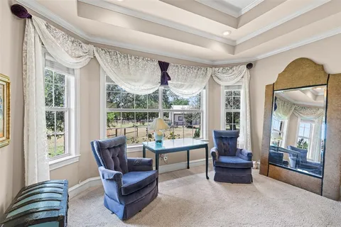 a bedroom with a bed and ceiling fan