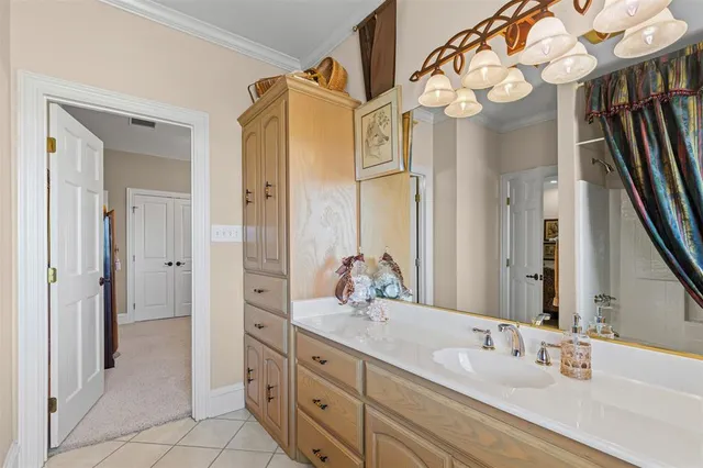 a bathroom with a granite countertop sink mirror and a bathtub with shower