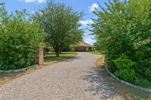 a view of road with tree in the background