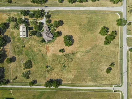 a view of a balcony with wooden floor