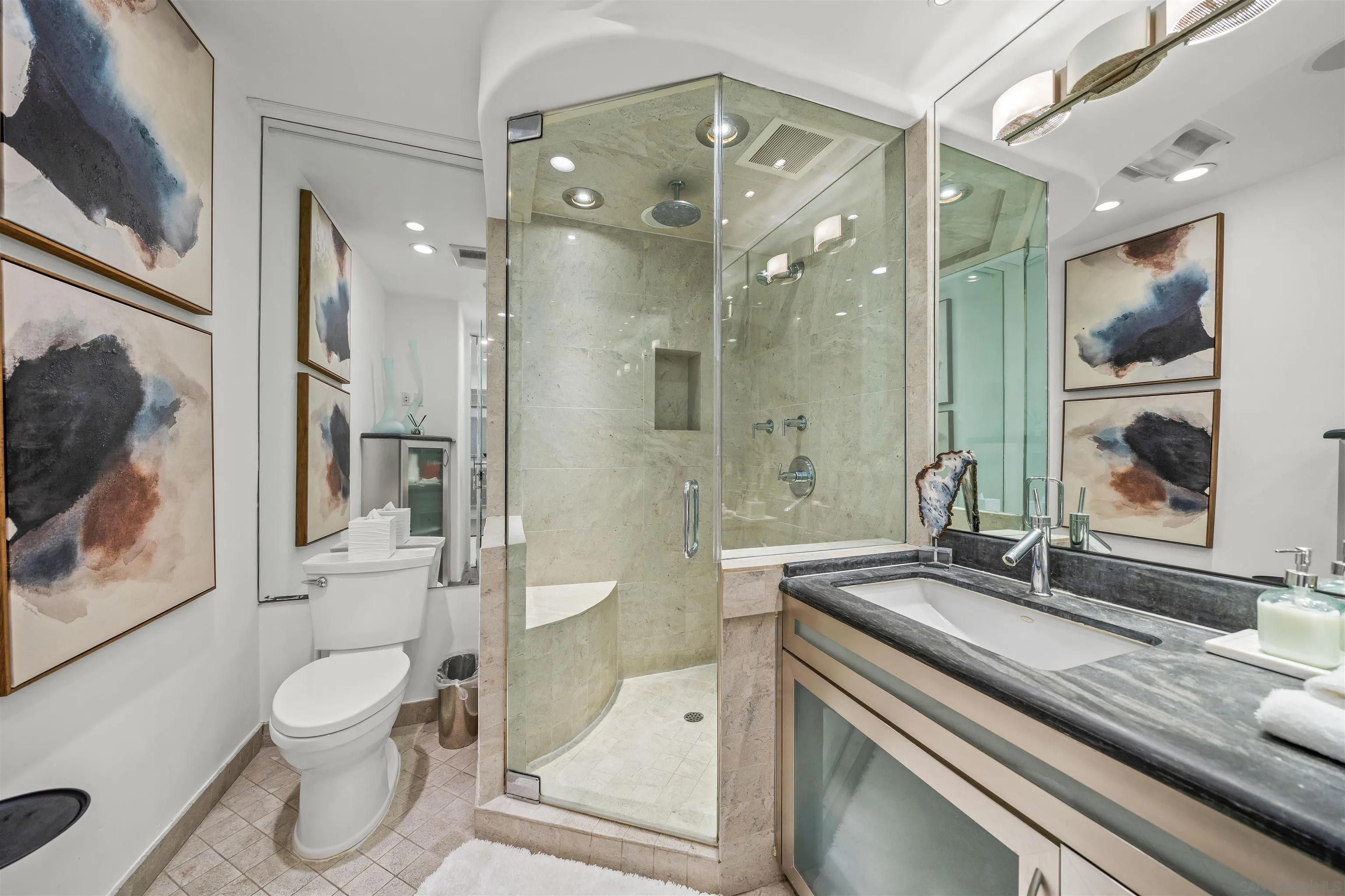 2999 Ocean Front Walk, Unit 2 San Diego, CA 92109 - Photo 11 of 25 a bathroom with a granite countertop sink toilet a mirror and shower